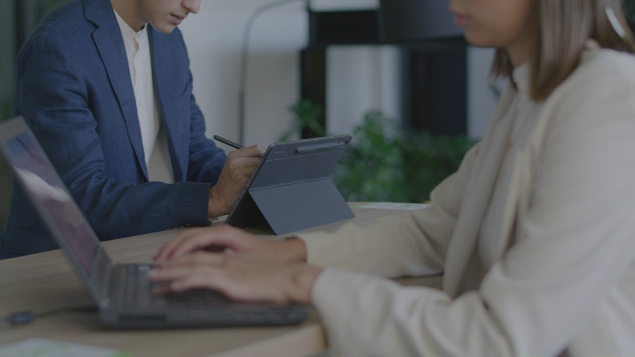 A client reviewing a software milestone before payment release